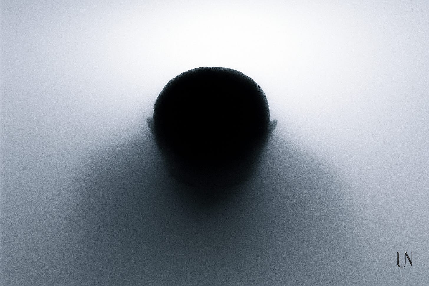 A dark silhouette of a person’s head seen from above, fading into a soft white fog. The image evokes disappearance, anonymity, and resilience. A dark silhouette of a person’s head seen from above, fading into a soft white fog. The image evokes disappearance, anonymity, and resilience.