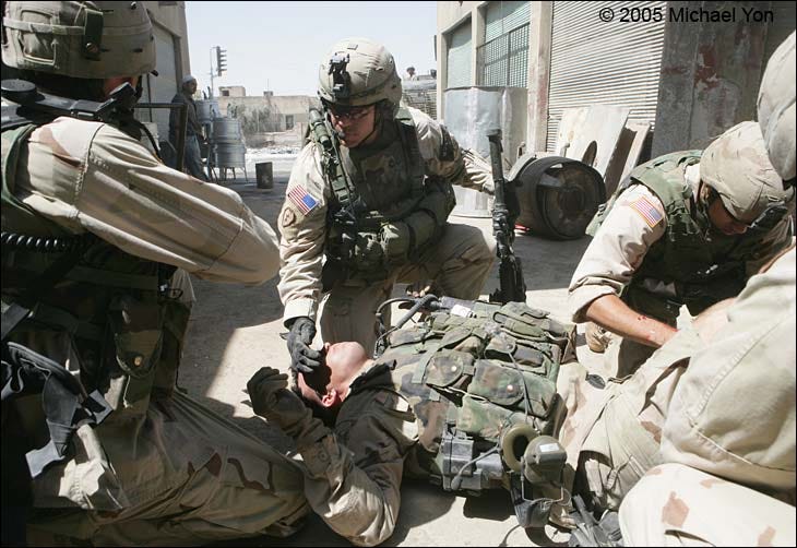 SFC Bowman shields the eyes of his Commander.