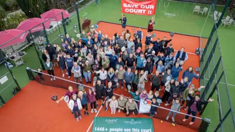 The Retreat Hotel, Elcot Park, and Courts Padel An areal shot of people at a padel court, with two of them holding a banner reading Save Our Court. The Retreat Hotel, Elcot Park, and Courts Padel An areal shot of people at a padel court, with two of them holding a banner reading Save Our Court.