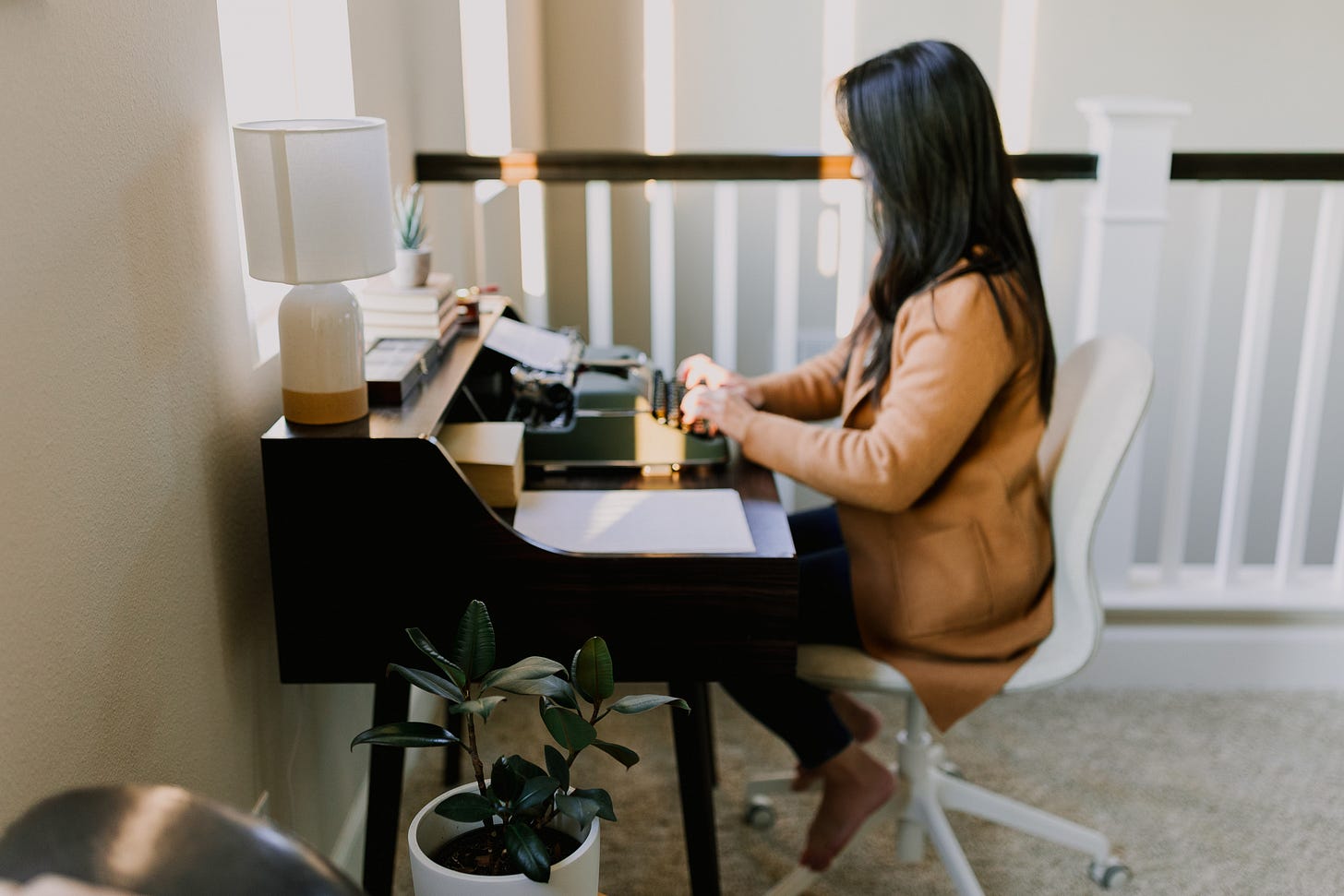 Tiffany Chu writing sitting at late son Ren's desk