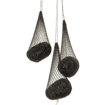 Sculpture with three dark nets hanging