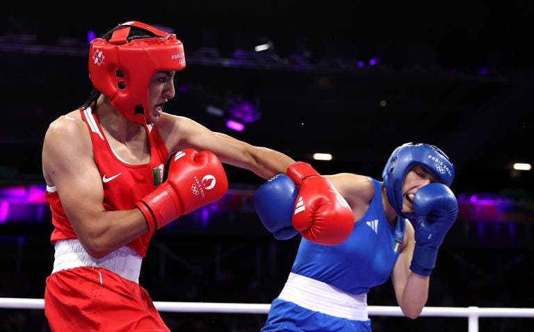Imane Khelif (red) won after her opponent Angela Carini (blue) abandoned the fight - Getty Images/Richard Pelham