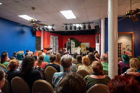 Father Nathan Monk captivates his audience with tales of growing up, chapters of his life, and the road to the Broom of Doom tour