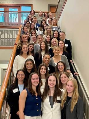 A group of women on a staircase

AI-generated content may be incorrect.