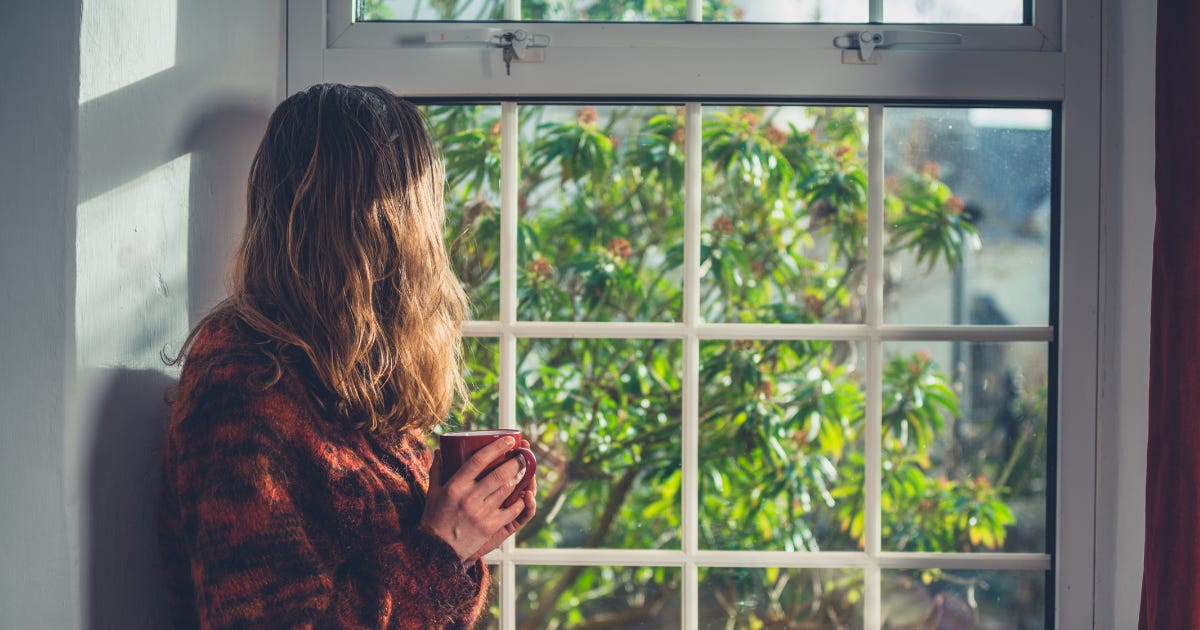Herbal tea in morning sunlight as part of daily wellness routine Herbal tea in morning sunlight as part of daily wellness routine
