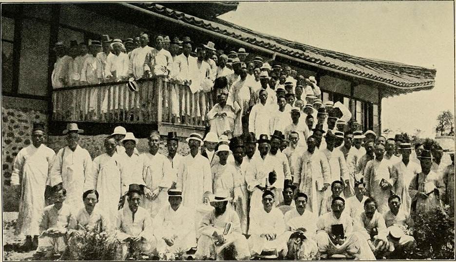 A group of people in white standing on a porch
AI-generated content may be incorrect. A group of people in white standing on a porch
AI-generated content may be incorrect.