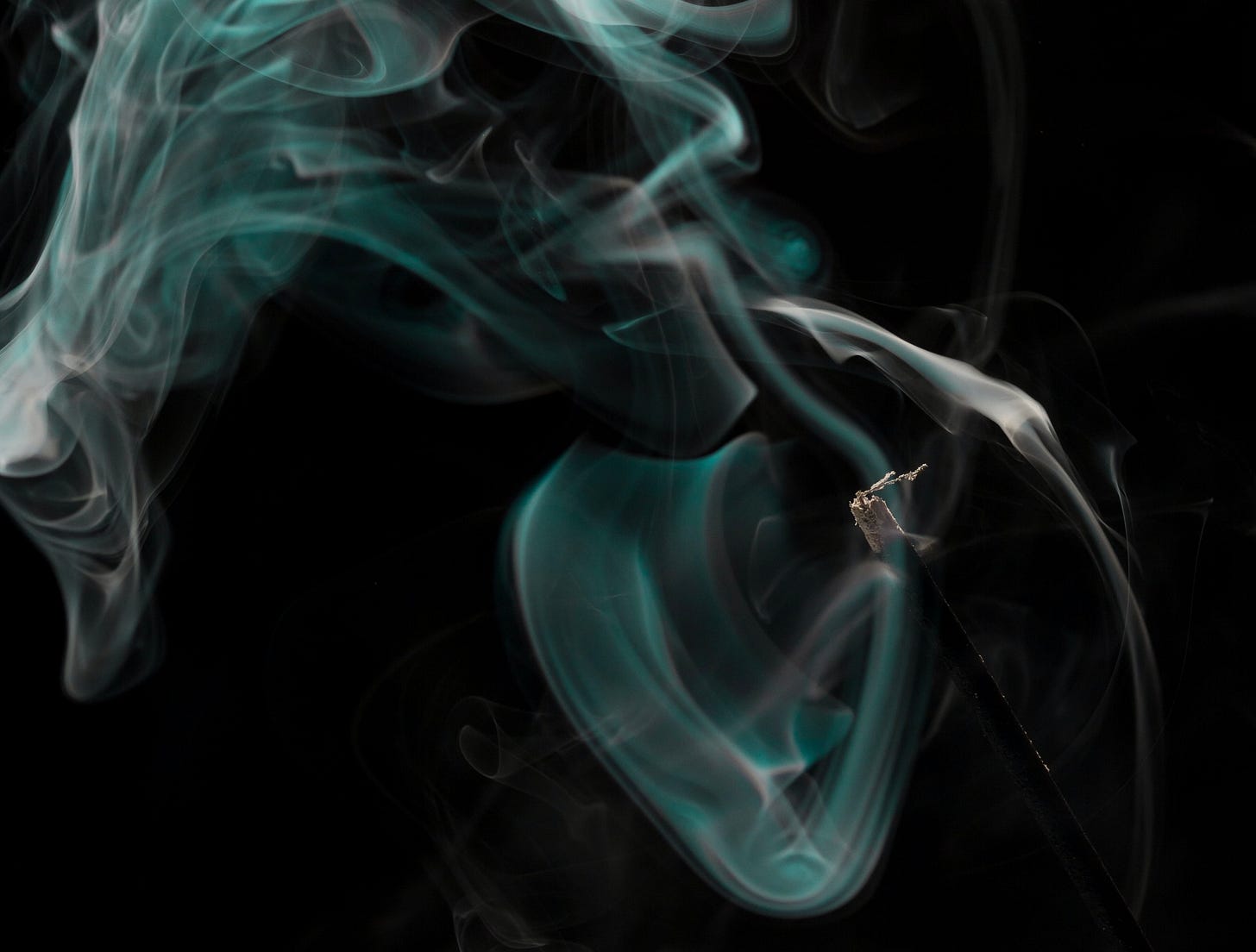 Smoke from a match that has been blown out 