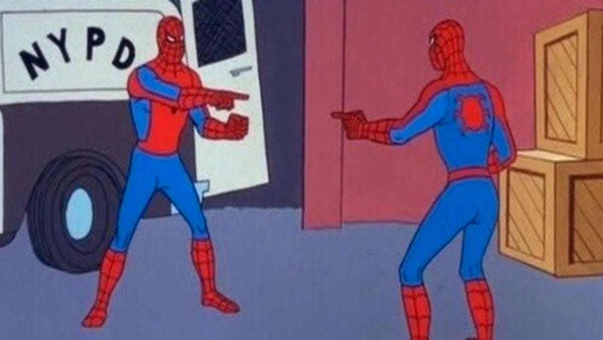 In a somewhat low res image, two people dressed like Spider-Man point at each other in surprise in the 1967 Spider-Man animated TV series. (The Spider-Man Pointing at Spider-Man meme image.)