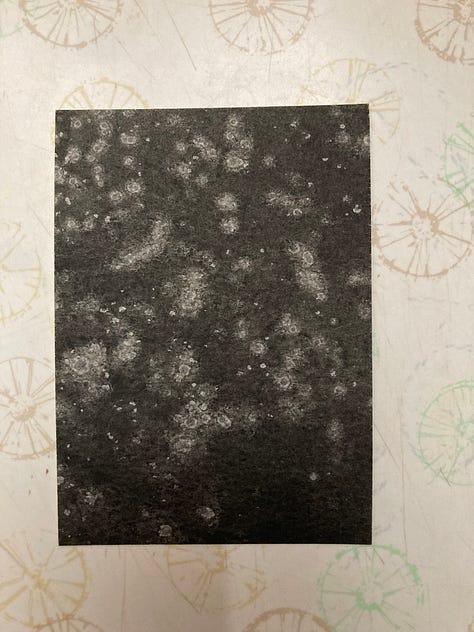 2.5 by 3.5 inch cards painted in black watercolor with random white splotches