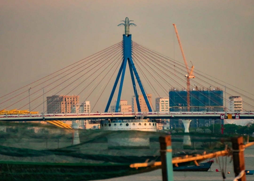 a large bridge over a body of water a large bridge over a body of water