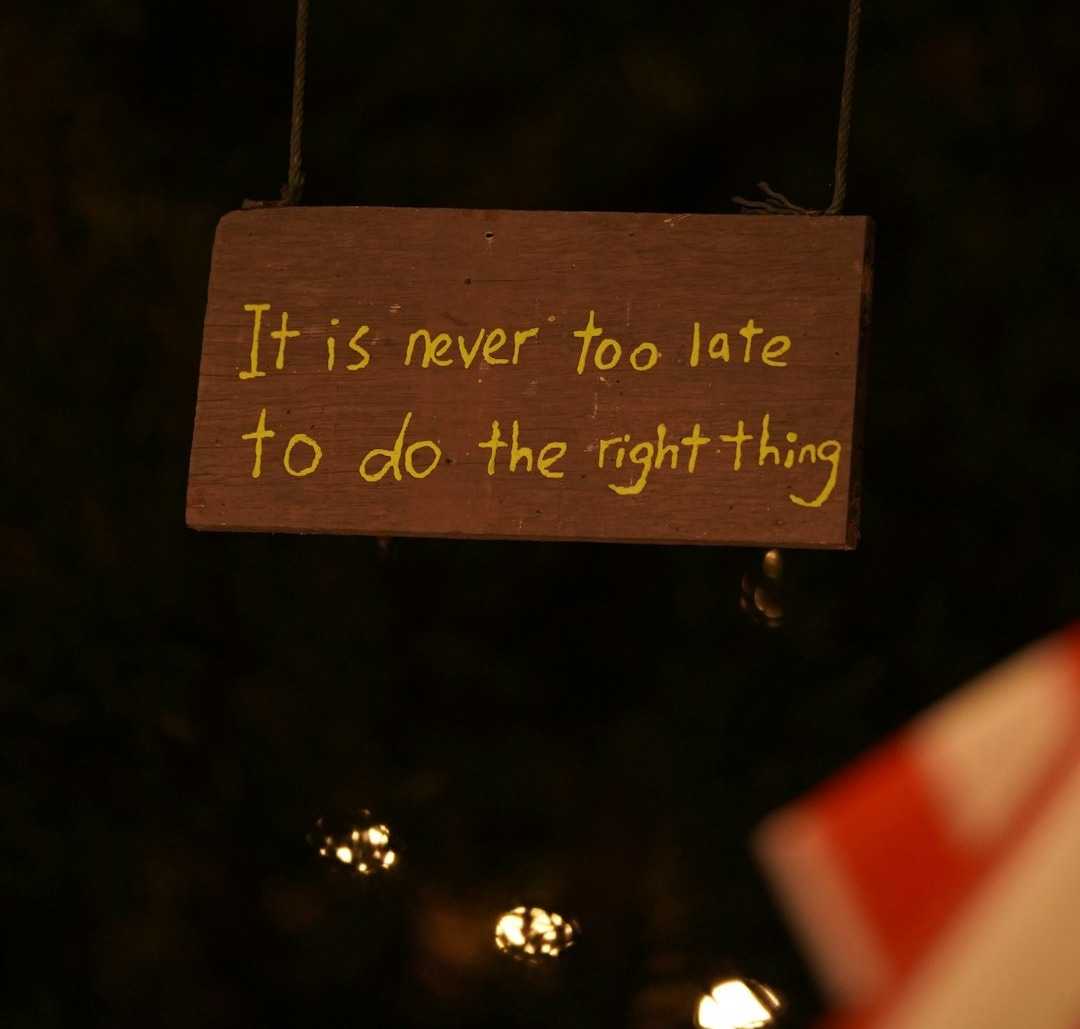 a wooden sign that says it is never to late to do the right thing a wooden sign that says it is never to late to do the right thing