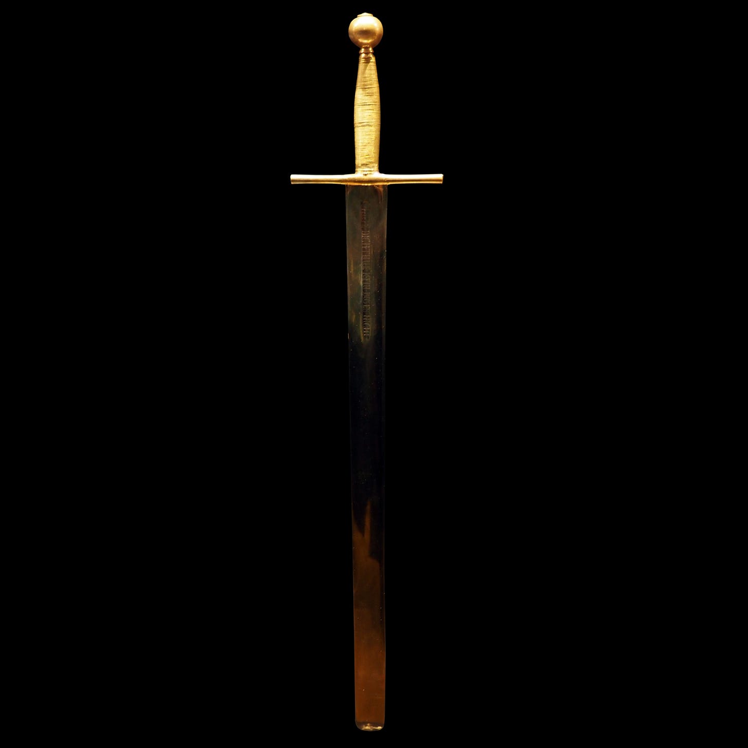 Sword of Justice with a gold-colored hilt against a black background. Sword of Justice with a gold-colored hilt against a black background.