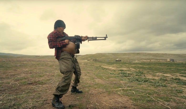 still from a movie featuring a figure holding a gun still from a movie featuring a figure holding a gun