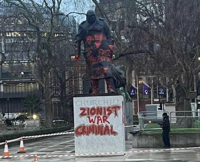 The statue of Winston Churchill covered in red paint with graffiti reading “Zionist War Criminal”

Picture credit: Sky News