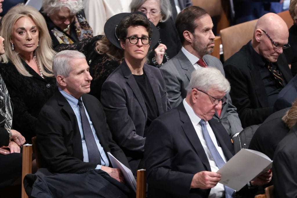Anthony Fauci and Rachel Maddow attending a funeral service.