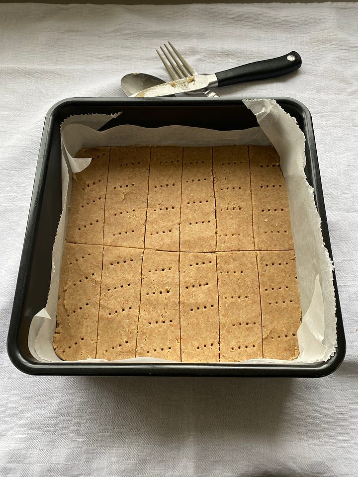 Shortbread dough in a square baking tin.