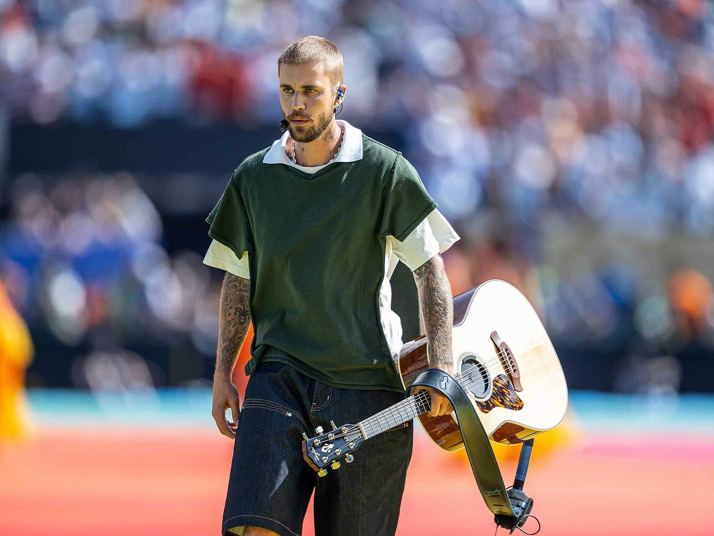 Justin Bieber used a specially made left-handed Taylor Gold Label acoustic  during the World Cup Final halftime show | Guitar.com