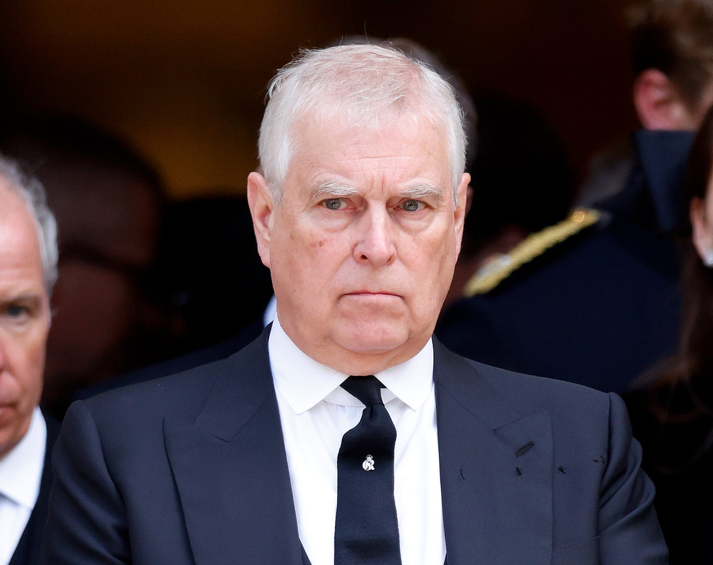 Prince Andrew frowning