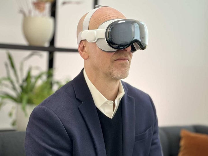 Several users wearing the Apple Vision Pro