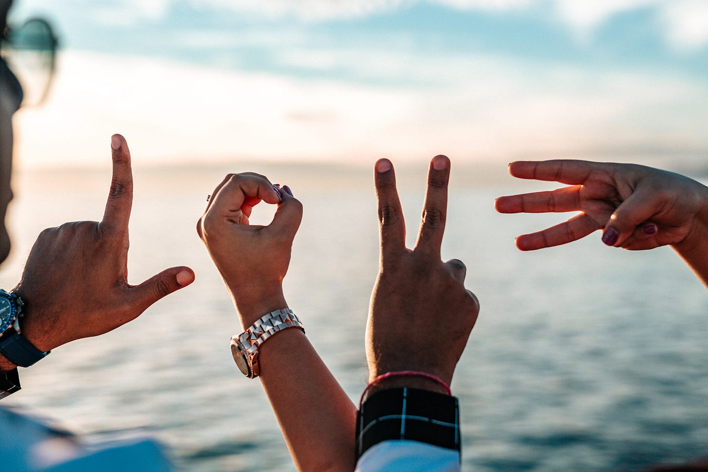 Fingers extended to spell the word love. Fingers extended to spell the word love.