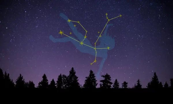An illustrated image of the constellation Andromeda over a line of dark trees silhouetted against the night sky. The constellation shows a woman falling back to the ground with her feet pointing up and her arms splayed out to the side. An illustrated image of the constellation Andromeda over a line of dark trees silhouetted against the night sky. The constellation shows a woman falling back to the ground with her feet pointing up and her arms splayed out to the side.
