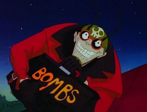 The Evil Midnight Bomber What Bombs At Midnight, from the animated version of The Tick. He wears a red jacket with black collar, a leather pilot's helmet with goggles and a skull insignia, and carries a black satchel helpfully labeled 'BOMBS' in big orange letters.  His face is contorted in a leering evil midnight smile what leers at midnight.