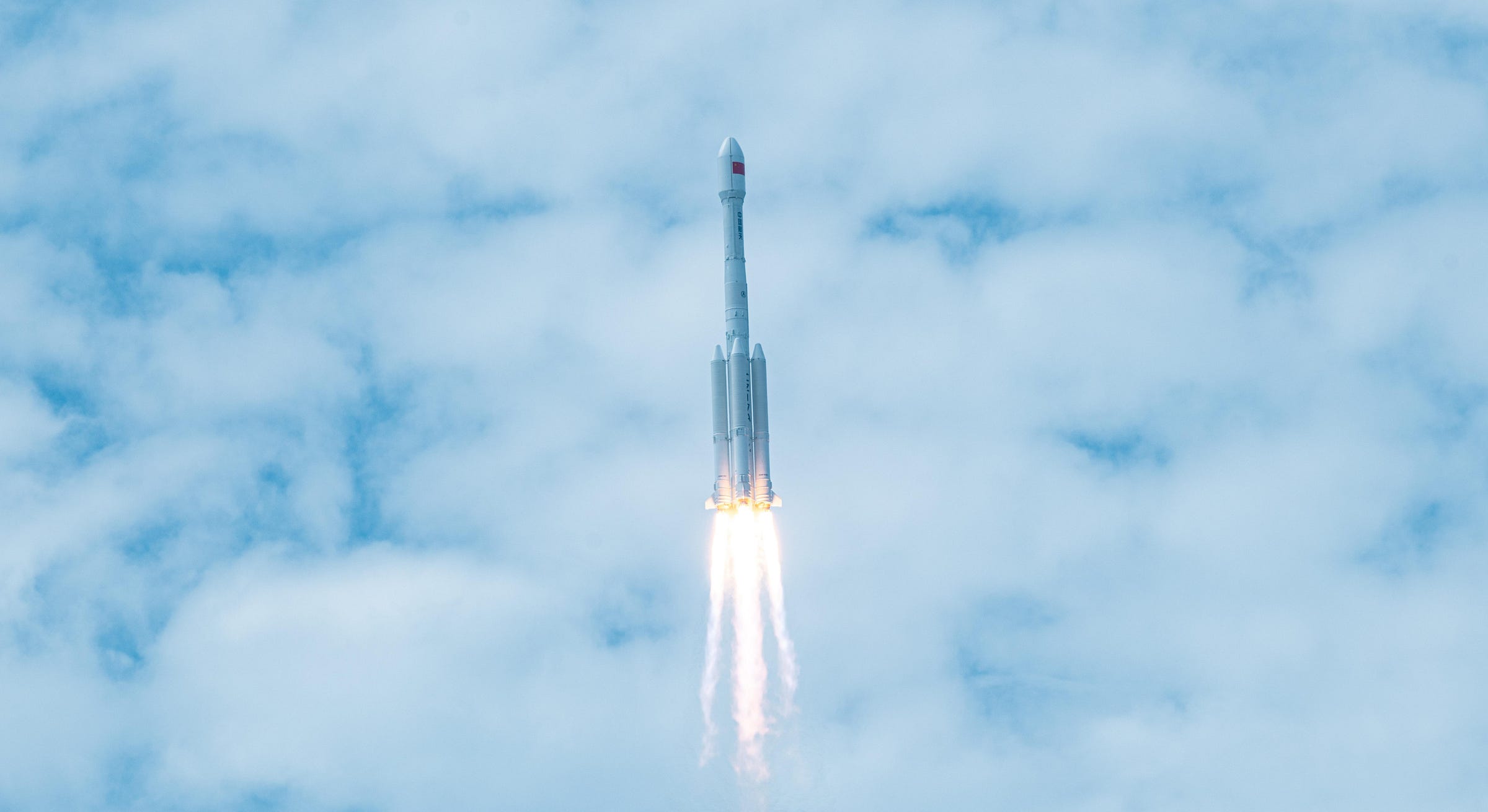 The Long March 7A Y14 vehicle during first-stage flight from the Wenchang Space Launch Site. The Long March 7A Y14 vehicle during first-stage flight from the Wenchang Space Launch Site.