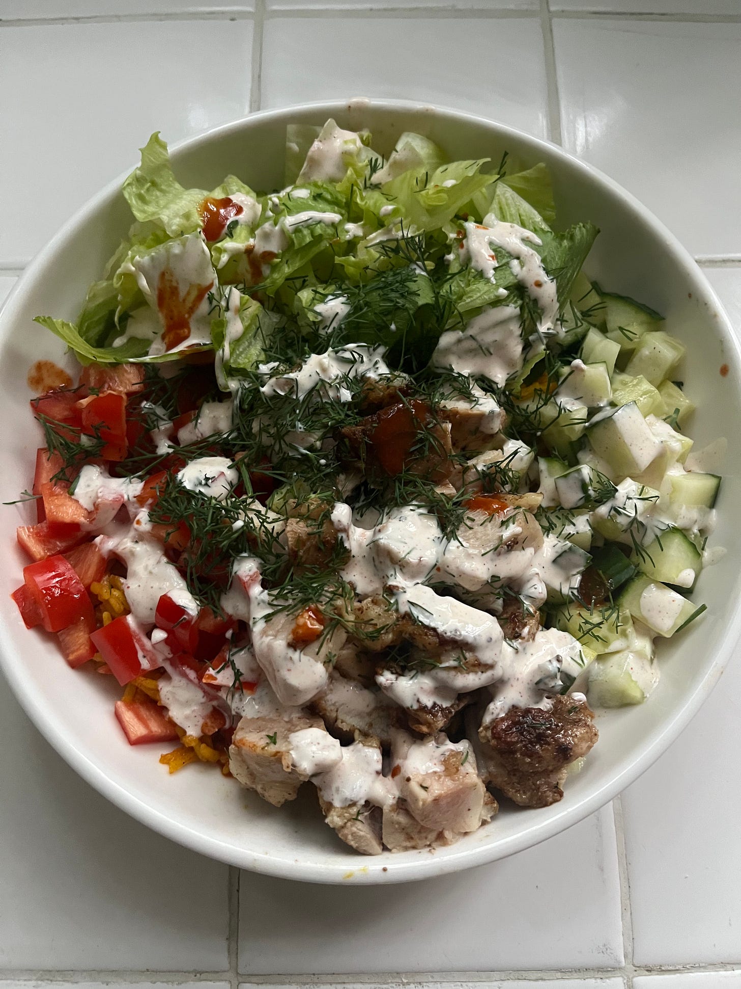 The same chicken bowl, now with white sauce, hot sauce and fresh dill The same chicken bowl, now with white sauce, hot sauce and fresh dill