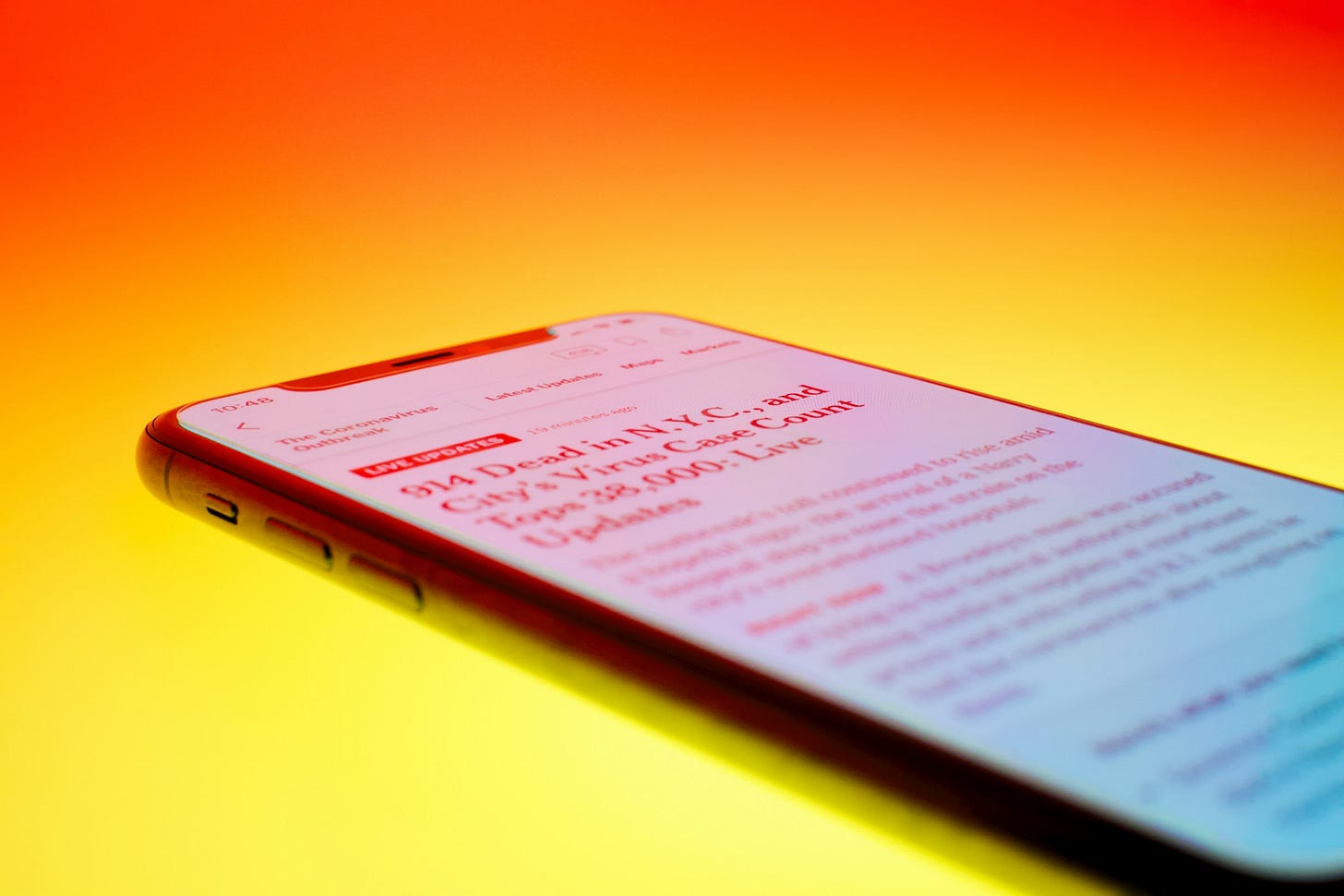 a phone with news of 914 dead in New York from coronavirus