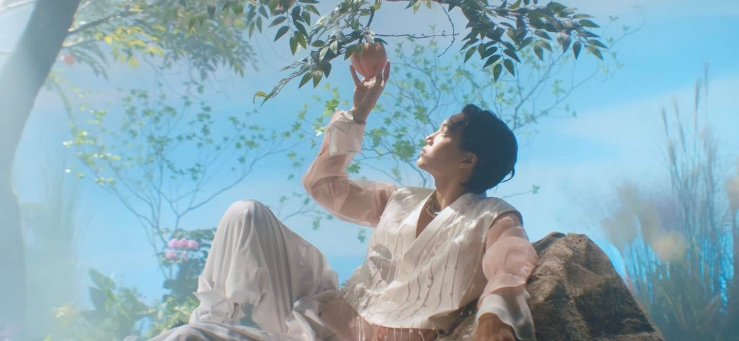 May be an image of 2 people, flower, outdoors and tree