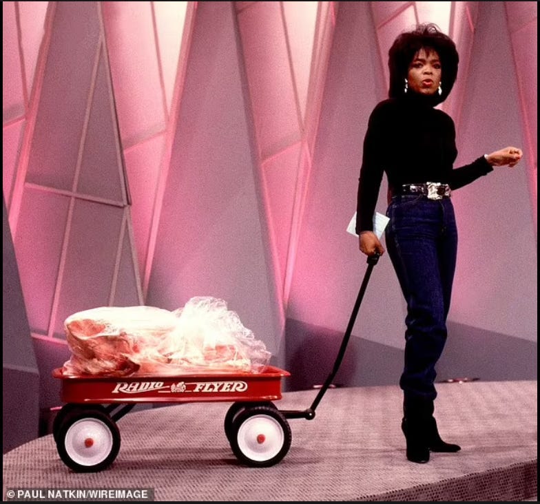 Oprah wheels her animal fat wagon onstage in 1988