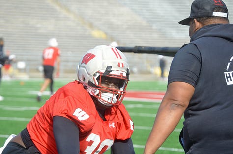 Wisconsin defensive linemen participate in individual position drills during Saturday's spring practice inside Camp Randall Stadium.