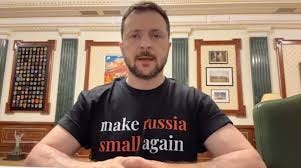 Zelensky wearing a tshirt that says Make Russia Small Again