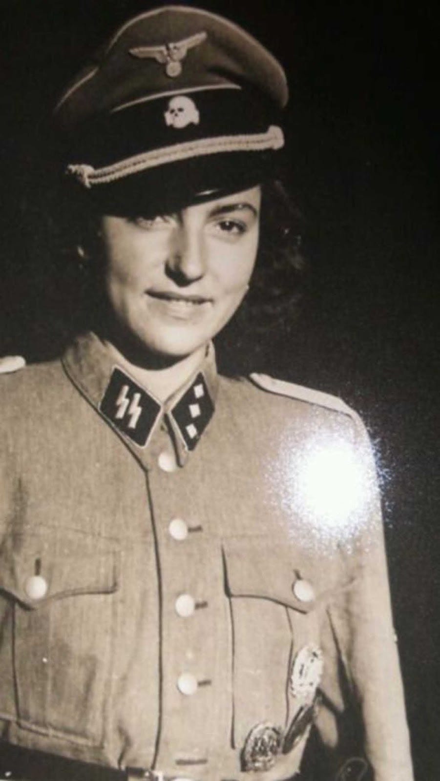 A further perspective on a woman fraternizing with German soldiers during the occupation. A further perspective on a woman fraternizing with German soldiers during the occupation.