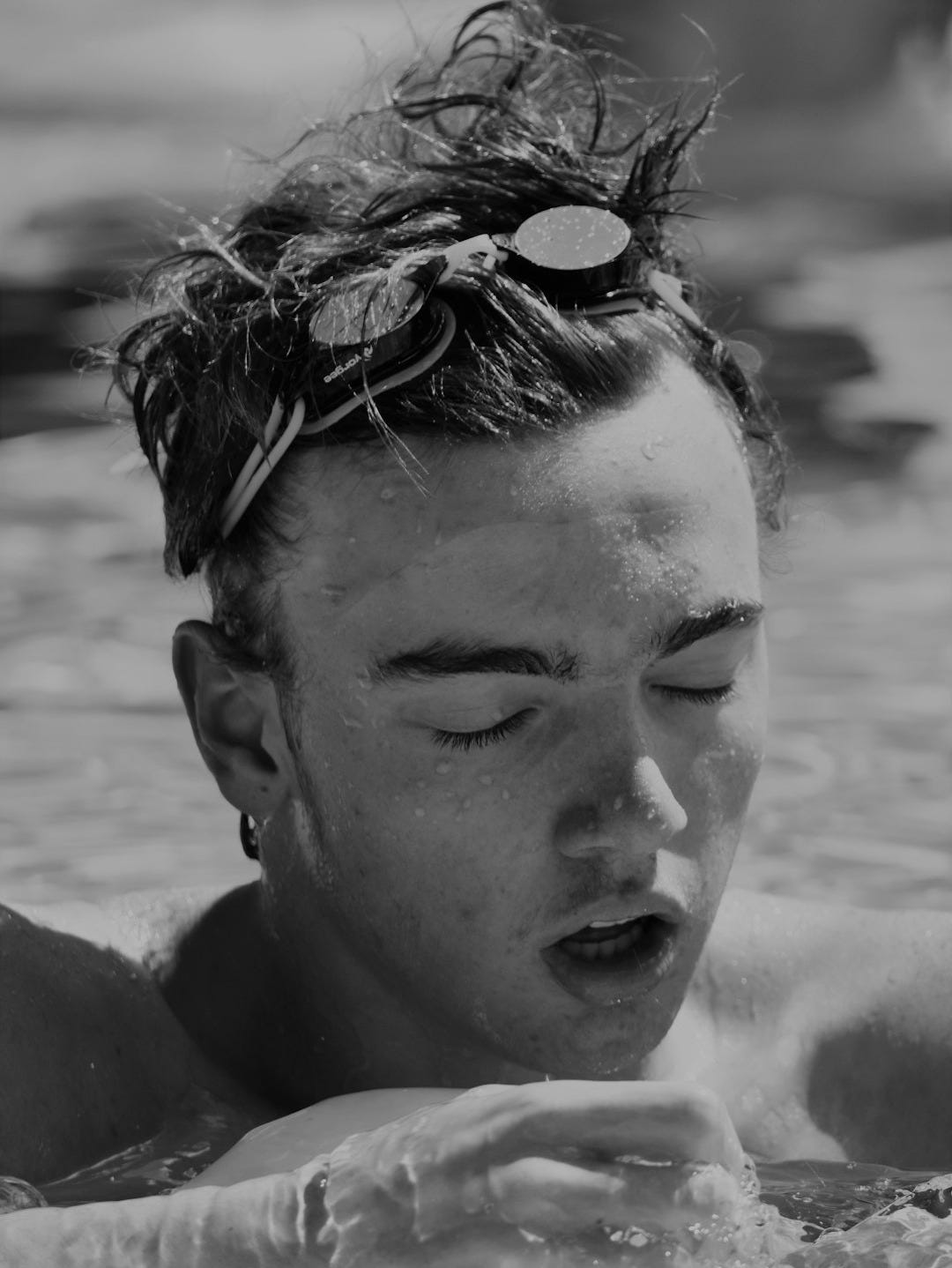man dipping in the pool