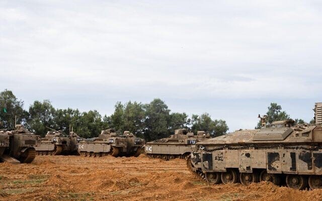 Armored vehicles of the 36th Division are seen at a staging ground in southern Israel, in a handout photo issued by the military on March 23, 2025. (Israel Defense Forces)