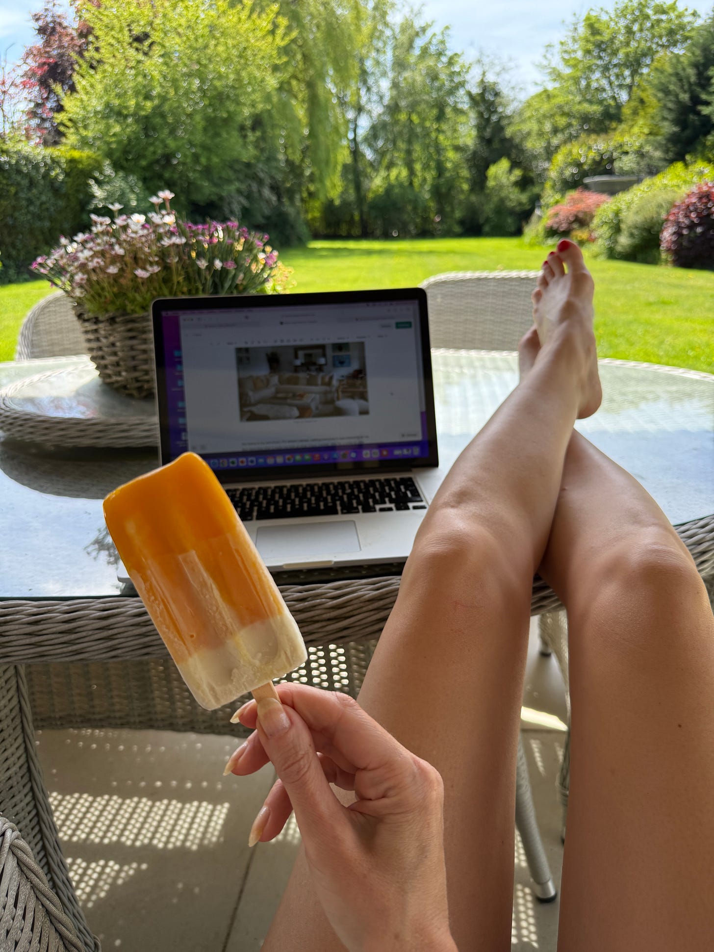 sitting in my garden in the sunshine eating an ice lolly