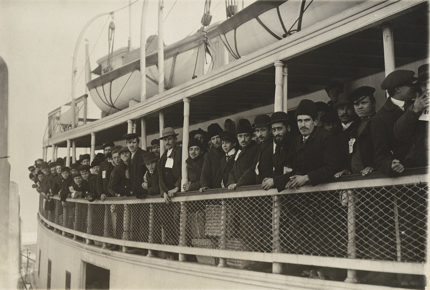 Photo of immigrants on a ferry near Ellis Island, 1910