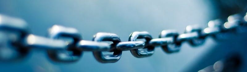 tilt shift lens photo of stainless steel chain