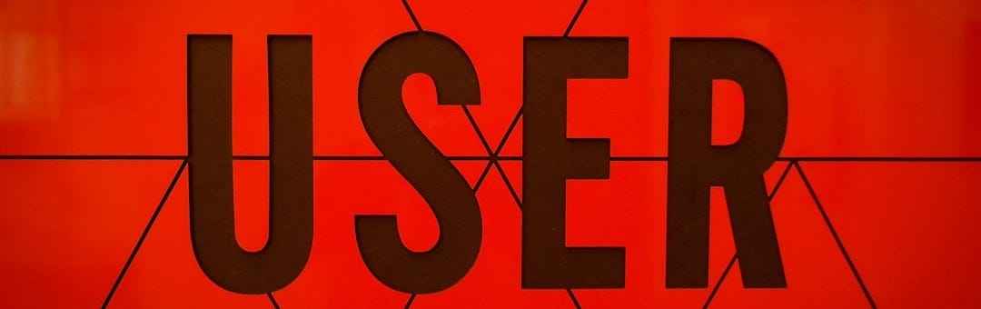 a close up of the word user on a wall