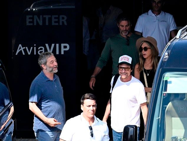The group - including Aniston's BFF Jason Bateman (in cap) - looked in great spirits as they headed out