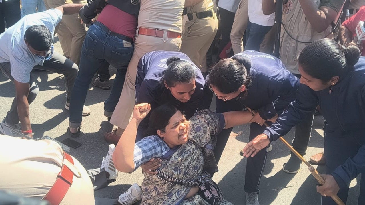 CITU Karnataka State secretary resisting arrest. CITU Karnataka State secretary resisting arrest.