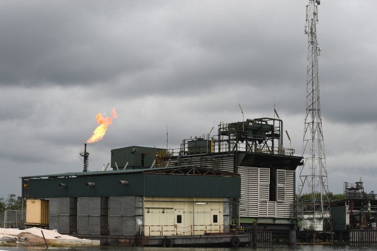 A gas flare burns at the Batan flow station operated by Chevron under a joint-venture arrangement with the Nigerian National Petroleum Corporation A gas flare burns at the Batan flow station operated by Chevron under a joint-venture arrangement with the Nigerian National Petroleum Corporation