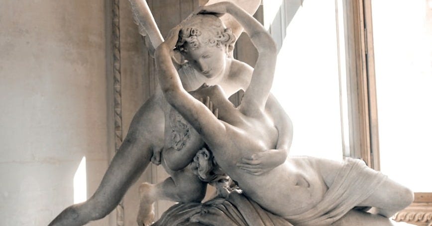 woman and angel kissing statue