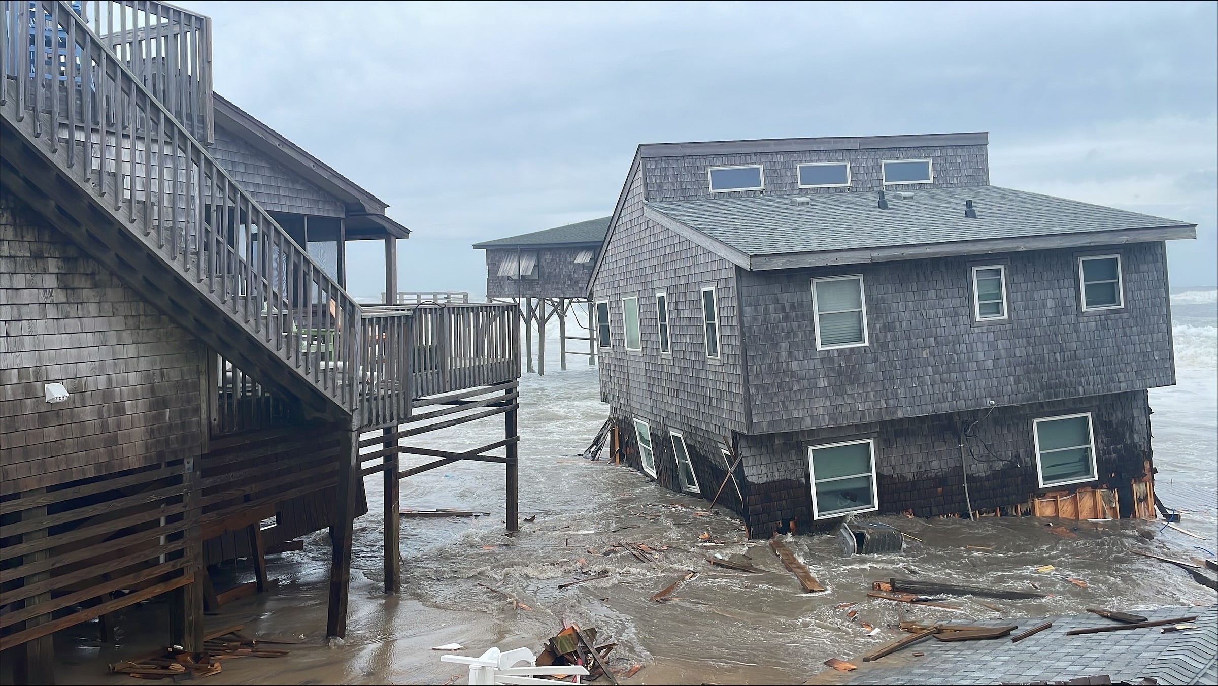 House collapsing into ocean House collapsing into ocean