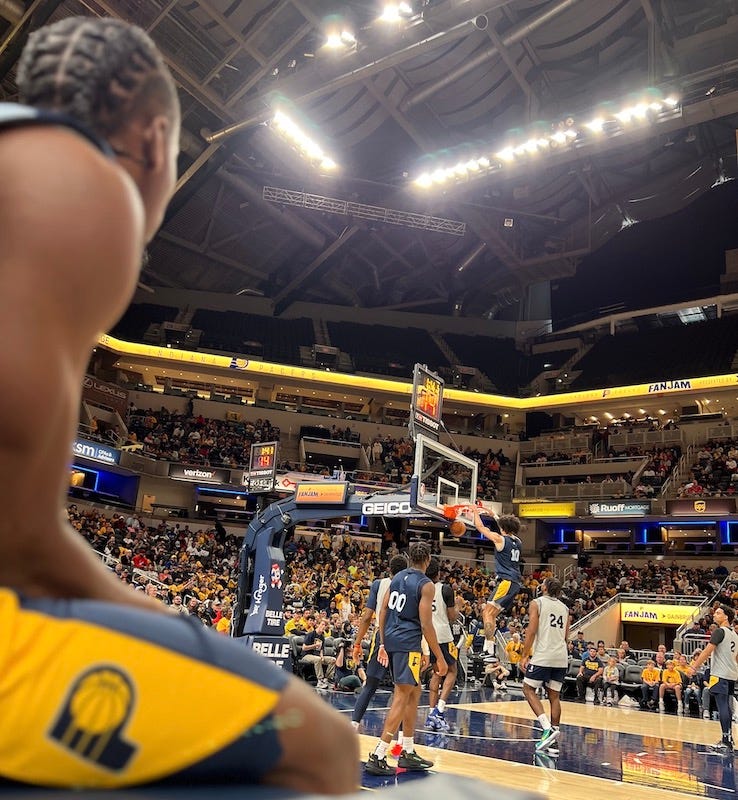 Aaron Nesmith watches as Kendall Brown dunks at Pacers FanJam.