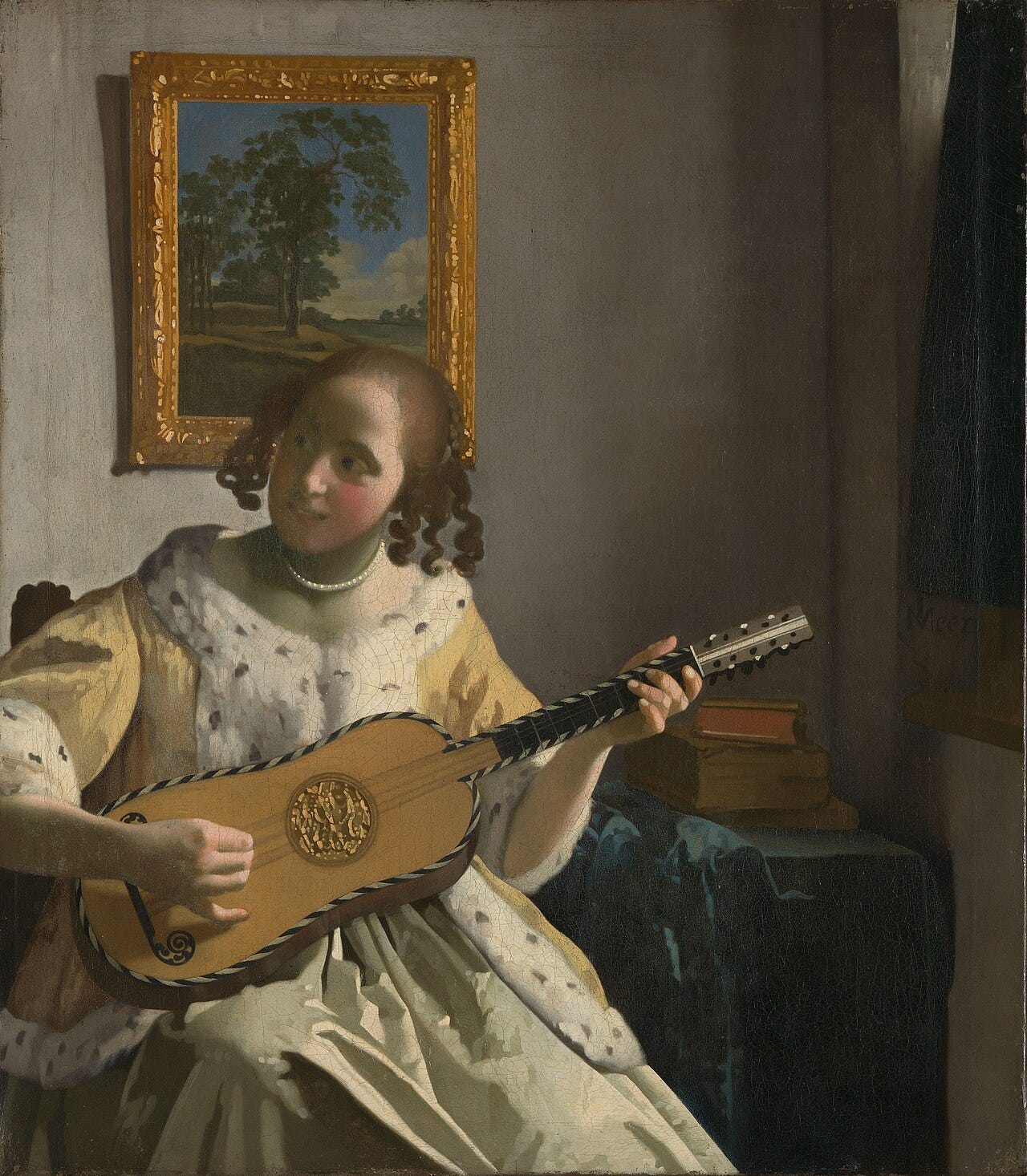 Vermeer's Guitar Player, a young woman turned half away as if someone just entered Vermeer's Guitar Player, a young woman turned half away as if someone just entered