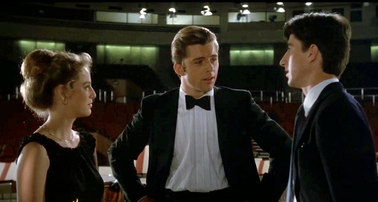 Maxwell Caulfield in a tuxedo in a screenshot from a movie