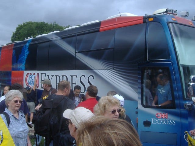 These protestors kept yelling at those on the CNN bus 'Tell the truth!' Maybe they need to start since their ratings are in the toilet. Notice the lady slapping up the 'Fox News' sign. These protestors kept yelling at those on the CNN bus 'Tell the truth!' Maybe they need to start since their ratings are in the toilet. Notice the lady slapping up the 'Fox News' sign.