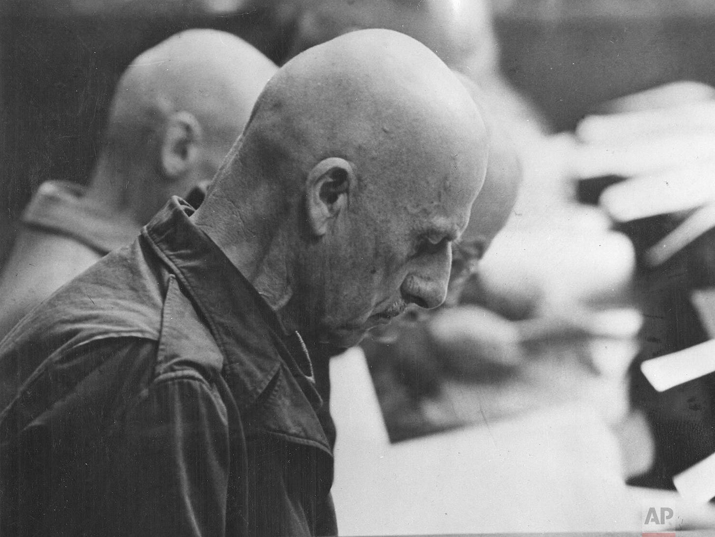 German Field Marshal Wilhelm Leeb during Nuremberg Trials, Case 12, on November 11, 1947, as he reads the accusations against himself and other high-ranking German officers, reflecting the continued pursuit of justice post-IMT. German Field Marshal Wilhelm Leeb during Nuremberg Trials, Case 12, on November 11, 1947, as he reads the accusations against himself and other high-ranking German officers, reflecting the continued pursuit of justice post-IMT.